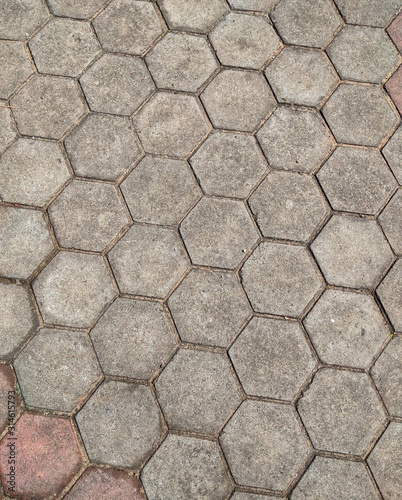 Texture or pattern on the floor with octagon shape bricks in natural sunlight.