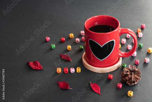 Wallpaper Mural Happy Valentine's Day. Red sweet heart coffee cup, colorful LOVE cube boxes, pieces of flower, pine cone on black background Torontodigital.ca