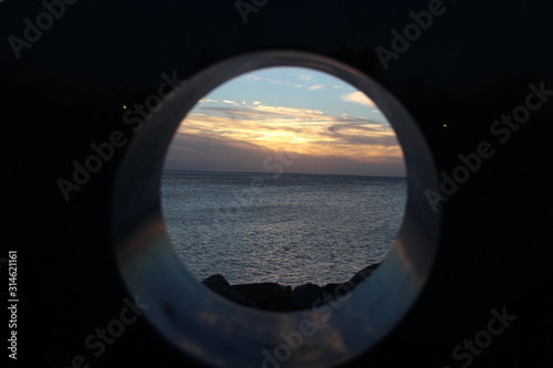 Sunset of ocean framed in a circle