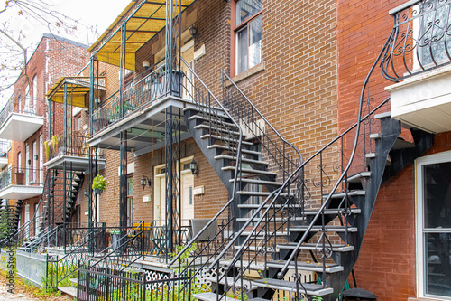 Montreal  typical victorian house with exterior staircase in the Plateau Mont-Royal district in autumn