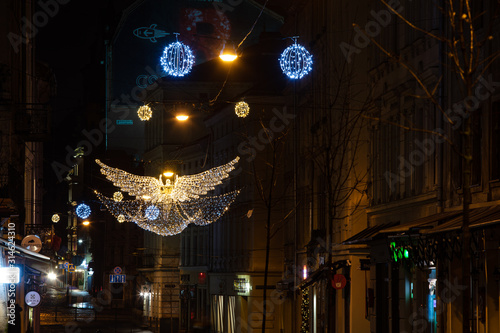 Christmas lighted decoration of angel hanging on Lviv street