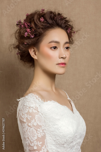 Asian teenage girl with real flower headdress