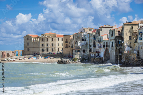 Residential buildings on the Tyrrhenian Sea shore in Cefalu city on Sicily Island in Italy