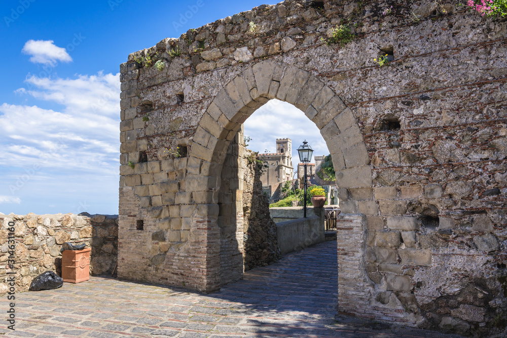 Historica gate in Savoca, small town on Sicily in Italy, view with Saint Nicholas Church also called Saint Lucy Church