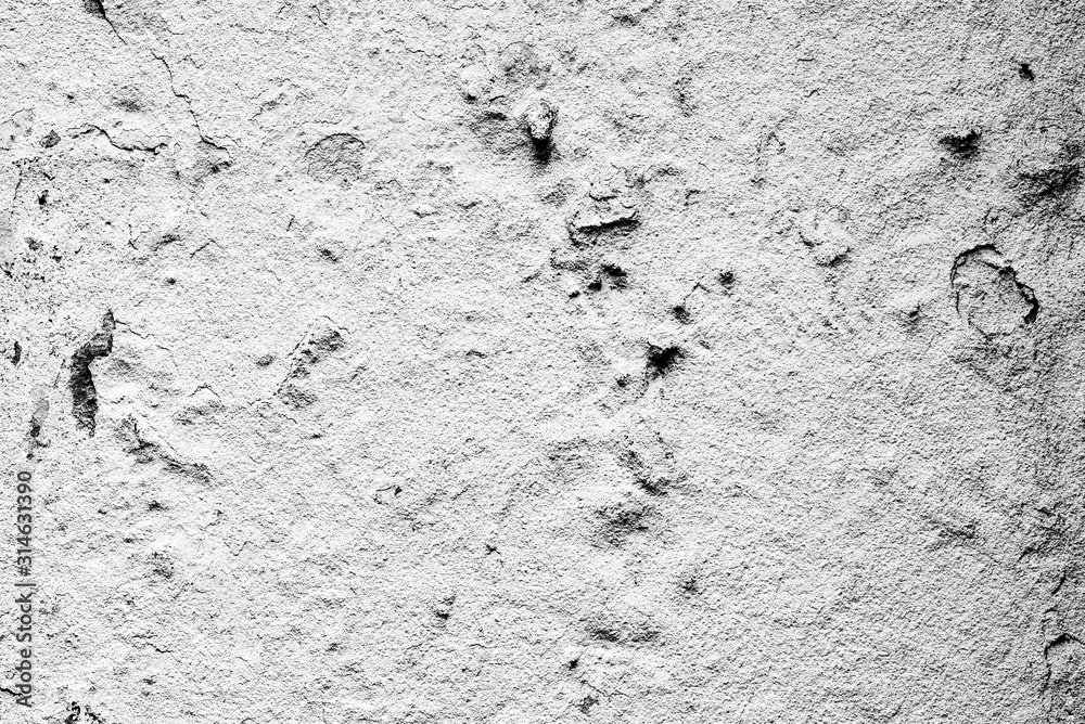 Texture of a concrete wall with cracks and scratches which can be used as a background Texture of a concrete wall with cracks and scratches which can be used as a background