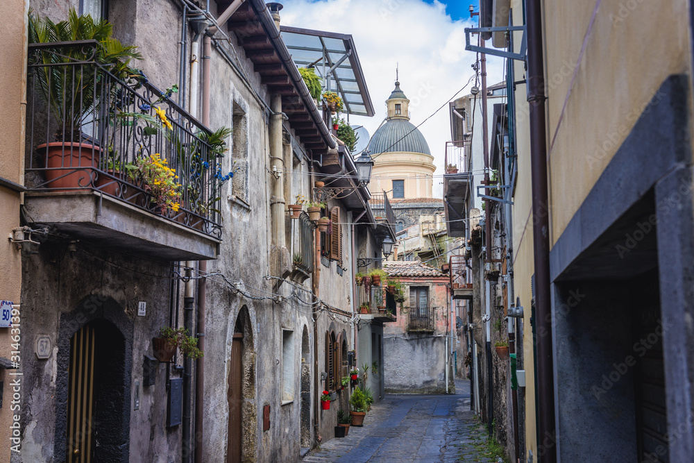 Quatris Street in the historic part of Randazzo city on Sicily Island in Italy, view with Santa Maria Assunta Basilica