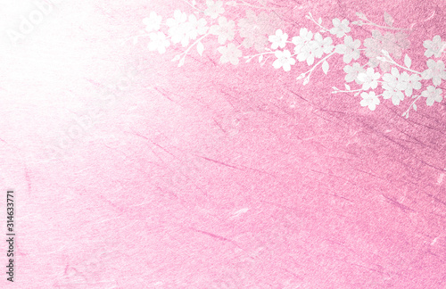 ピンクの和紙を背景にした桜