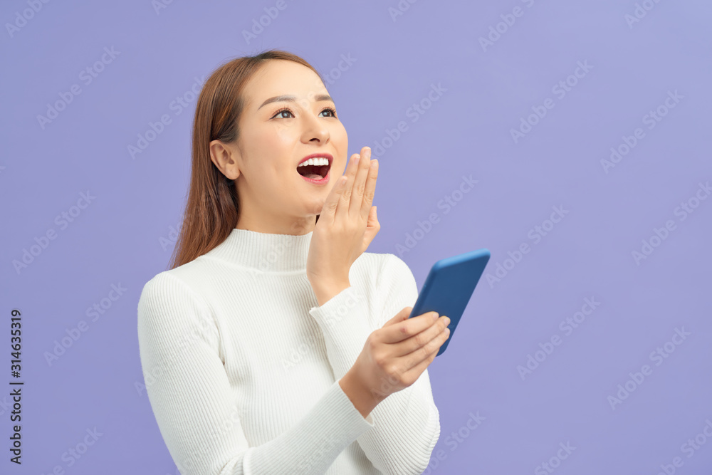 Happy asian girl using phone, celebrating success, online win, excited young woman reading good news, showing yes gesture Happy asian girl using phone, celebrating success, online win, excited young woman reading good news, showing yes gesture