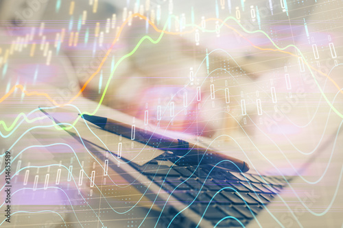 Stock market graph and table with computer background. Multi exposure. Concept of financial analysis.