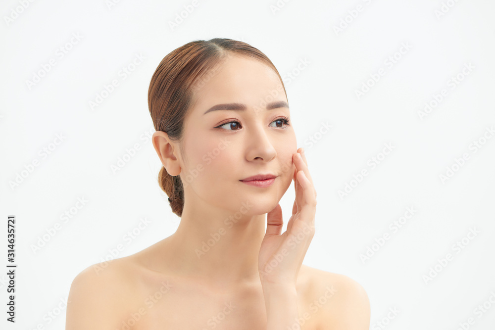 Portrait of young beautiful Asian woman touching her face with naked body over white background. Portrait of young beautiful Asian woman touching her face with naked body over white background.