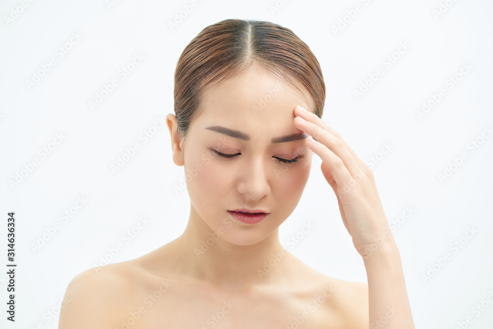 Tired and exhausted Asian woman touching her forehead over white background. Tired and exhausted Asian woman touching her forehead over white background.