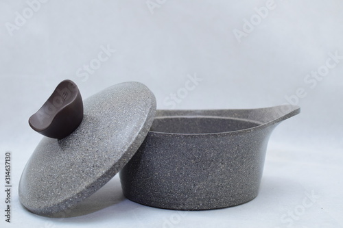 Mock up / design set of elegant and traditional cooking pots and goblet , grey and black made of ceramic isolated on white background 