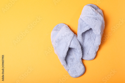 slippers on a colored background top view.