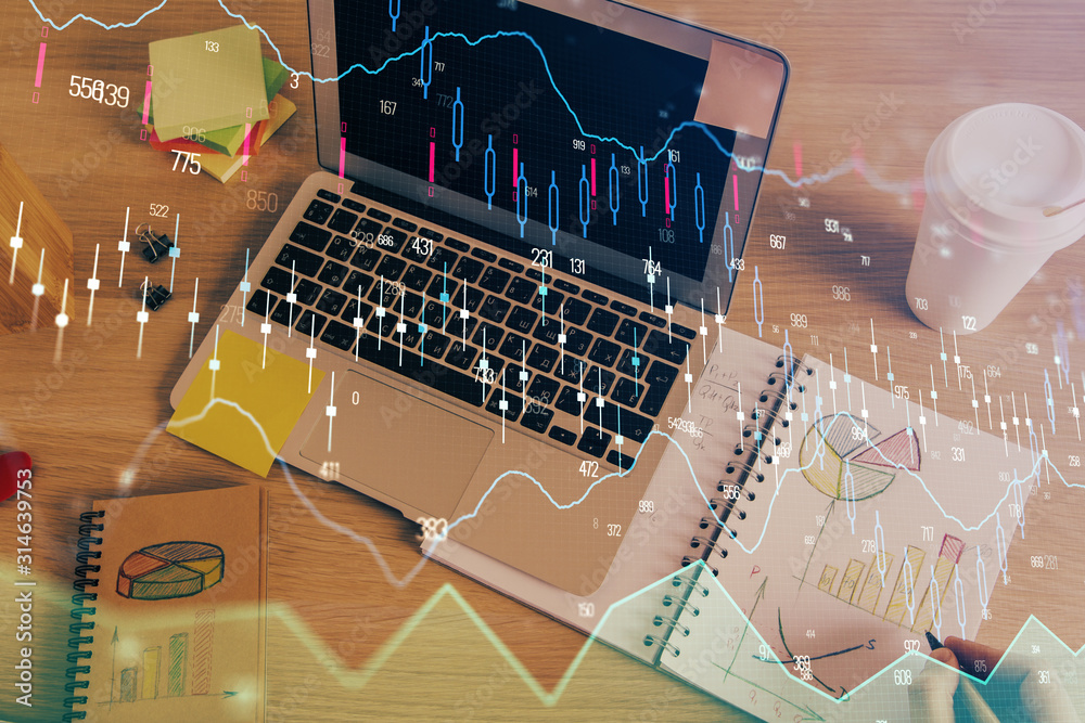 Double exposure of man's hands writing notes of stock market with forex chart. Double exposure of man's hands writing notes of stock market with forex chart.