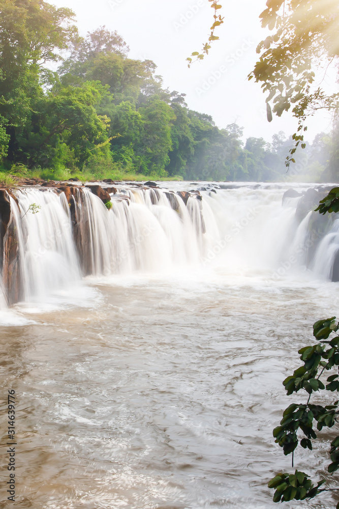 Fototapeta premium Tad Pha Suam Waterfall at sunrise.