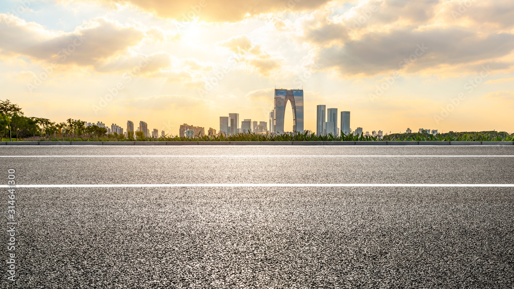 Empty asphalt road and beautiful city skyline in Suzhou Empty asphalt road and beautiful city skyline in Suzhou