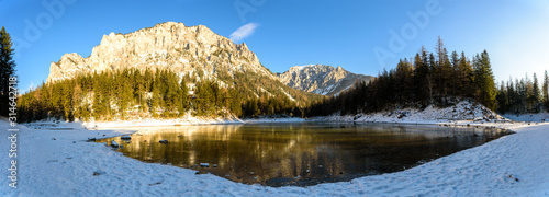 Peaceful mountain view with famous green lake in Austria Styria. Tourist destination lake Gruner See in winter. Travel spot situated in Tragos in lime stone Alps of Hochschwab. photo