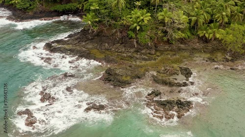 Wallpaper Mural Panama island jungle palm tree shoreline wilderness, waves crashing on rocky reef close up. Torontodigital.ca