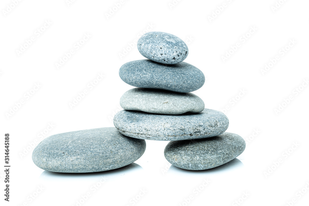 Stacked harmony stones in zen balance. pile of stones isolated on white background Stacked harmony stones in zen balance. pile of stones isolated on white background