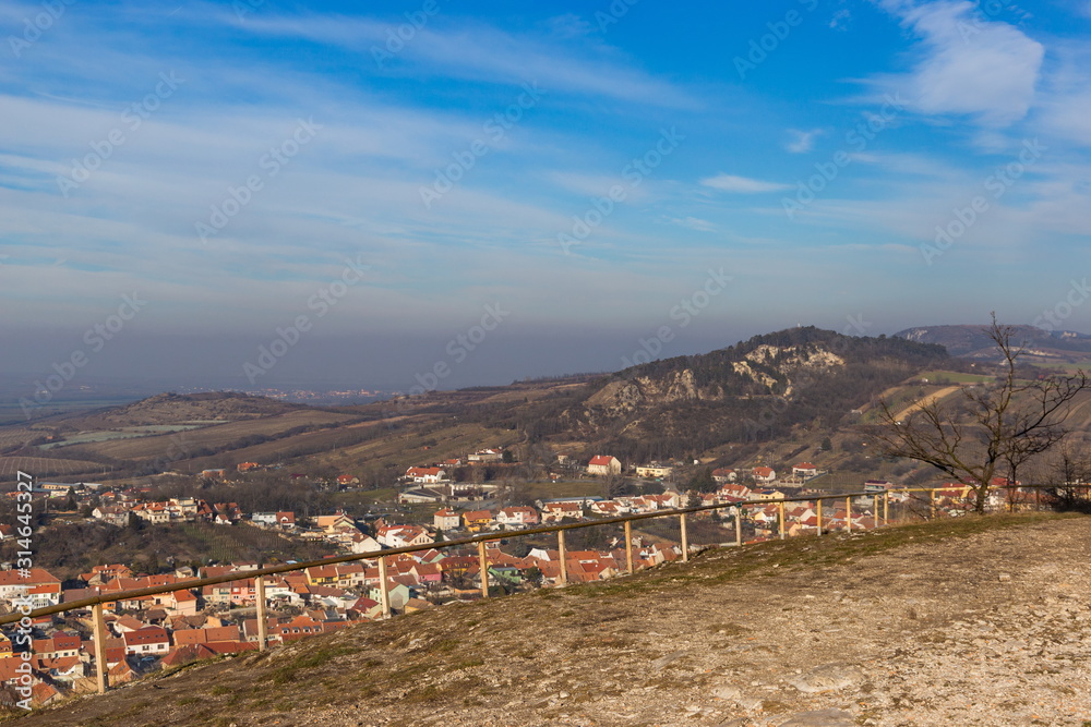 View to snowless hills in South Moravian region near Mikulov. Czech Republic.