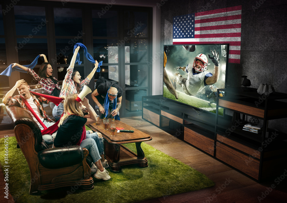 Group of friends watching TV, american football match, championship. Emotional men and women cheering favourite team, look on fighting for ball. Concept sport, competition, emotions Stock Photo | Adobe