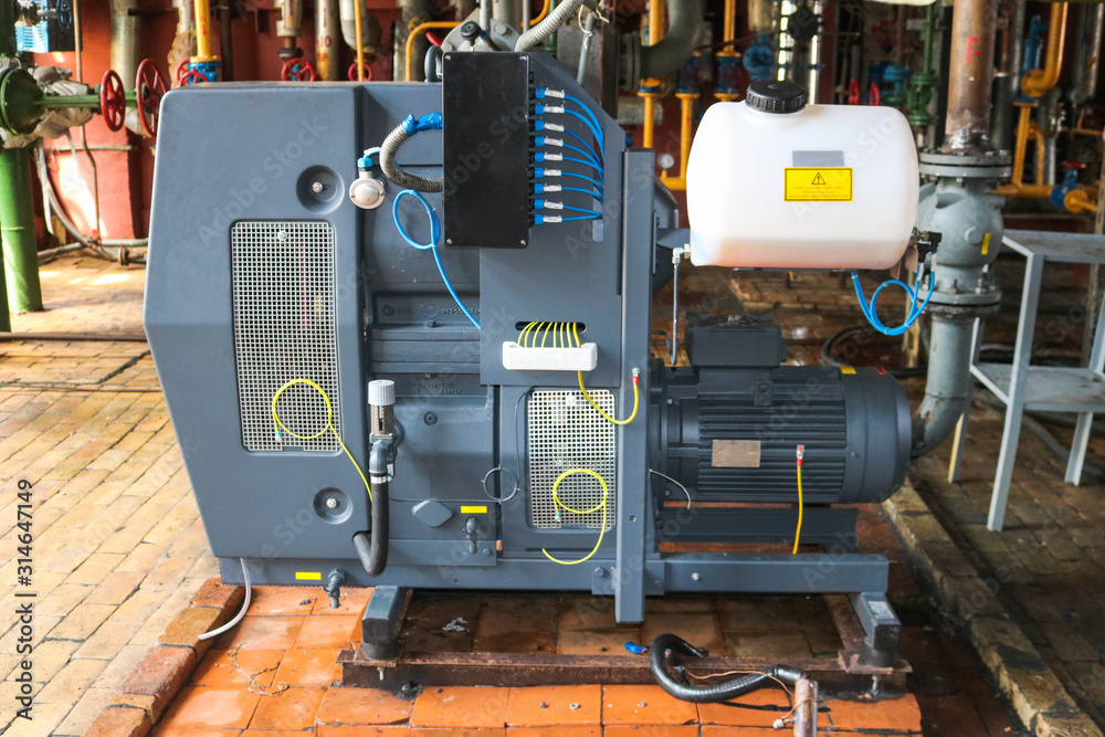 Large powerful industrial gas air centrifugal compressor for pumping gases and creating pressure with an asynchronous electric motor, equipment of a chemical oil refining petrochemical plant