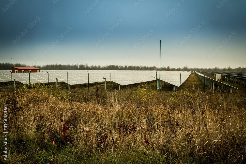 Sun batteries energy stands in the field