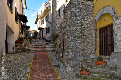 Veroli, Italy, 01/03/2020. A narrow street between the old houses of a medieval village