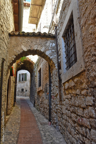 Fototapeta Naklejka Na Ścianę i Meble -  Veroli, Italy, 01/03/2020. A narrow street between the old houses of a medieval village