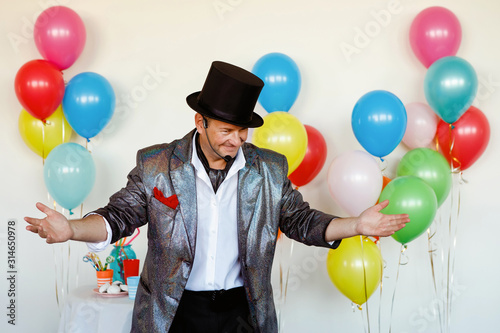 Magician in a black hat.