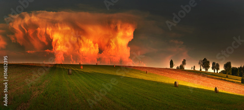 View of approaching thunderstorm at sunset