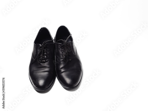 A pair of men's shoes made of genuine leather polished to a Shine, isolate on a white background