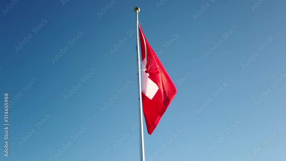 Swiss flag waving in the wind Swiss flag waving in the wind