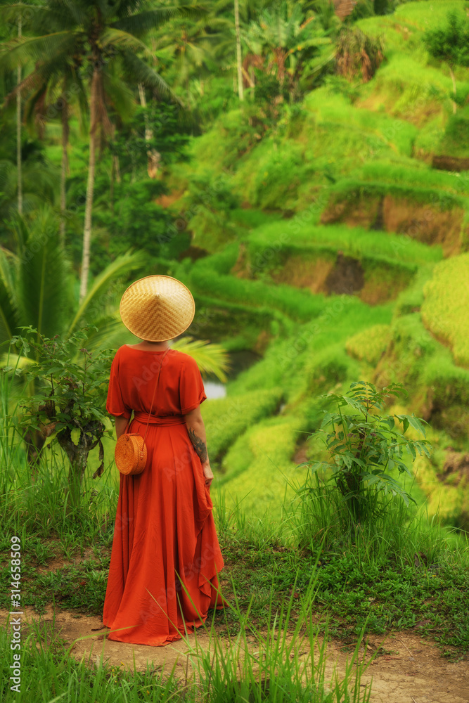 Woman walking on Tegalalang Rice Terrace, Bali