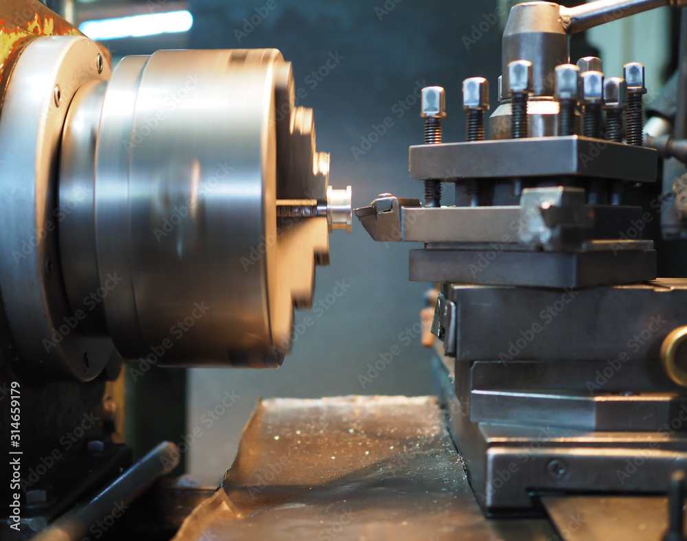 Fototapeta premium Using a metal processing lathe knife on a lathe, Turning knives Turning work according to plan