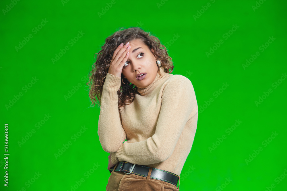 Young woman thinking hard about a decision, looking despaired. Young woman thinking hard about a decision, looking despaired.