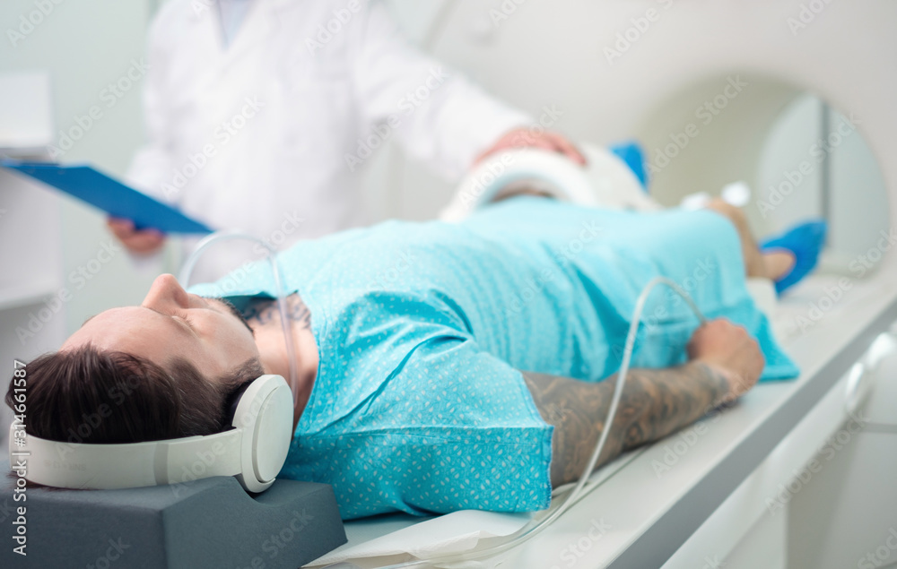 Patient visiting MRI procedure in a hospital Patient visiting MRI procedure in a hospital