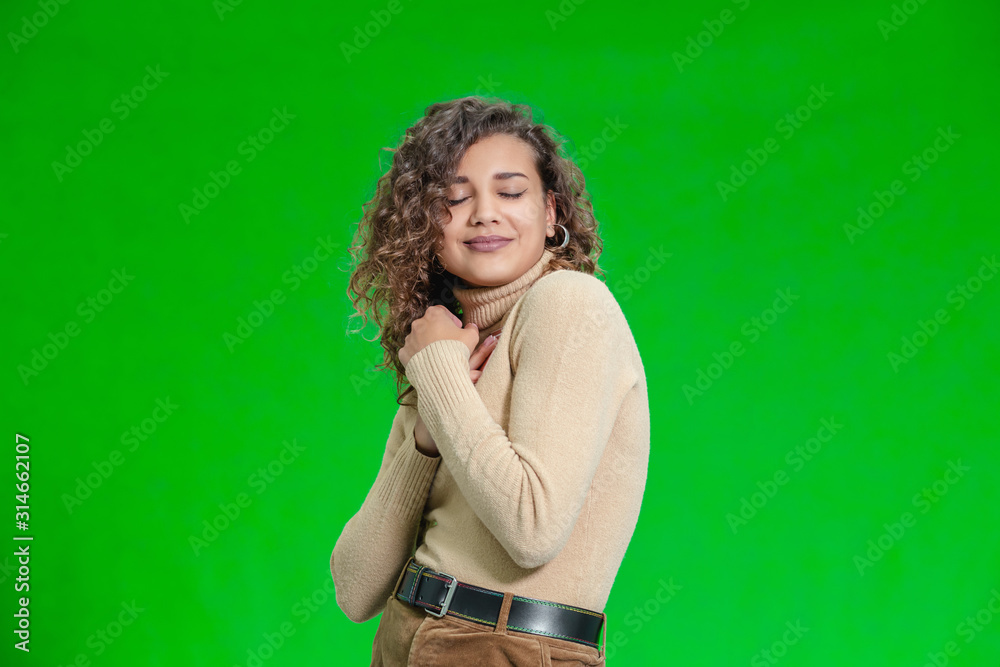 Gift of a dream concept. Excited female holds new phone close to her chest, rejoicing her new present. Gift of a dream concept. Excited female holds new phone close to her chest, rejoicing her new present.