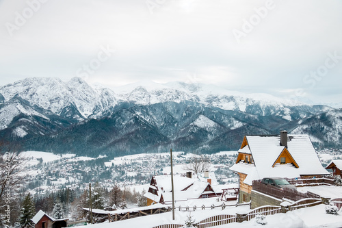 wooden houses in the mountains and snow