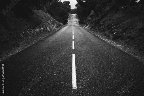 black and white low perspective of a secondary road