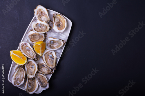 Fresh Oysters Ready to Be Served with Lemon and Champagne..