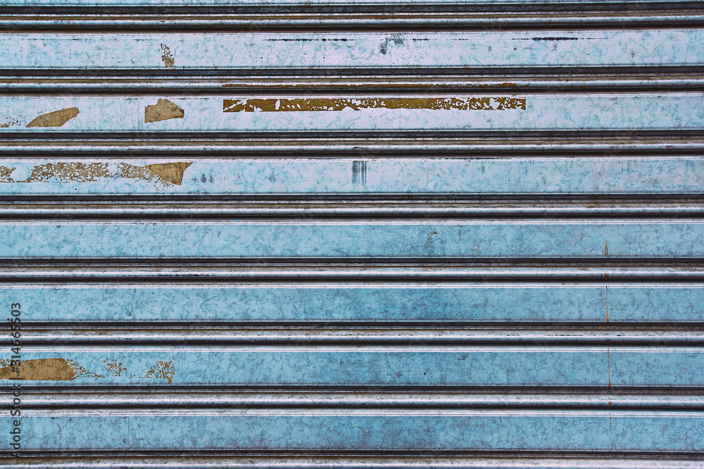 detail of stripped metal garage or store door texture; metal background