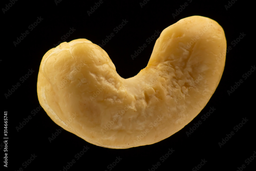 closeup of cashew nut on a gray background. vitamins and wholesome foods closeup of cashew nut on a gray background. vitamins and wholesome foods