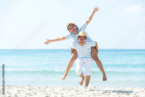 Romantic family asian couples lover relax and enjoy for honeymoon in luxury resort near the beach in Summer holiday. Tourism travel destination leisure tropical island. Travel Trips Concept.