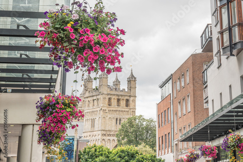 View of the Church of Exeter with flowers in the foreground.