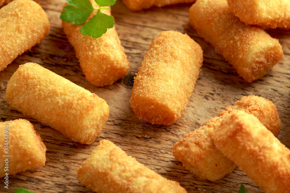 Homemade Potato Croquettes with dipping sauce on wooden board Homemade Potato Croquettes with dipping sauce on wooden board