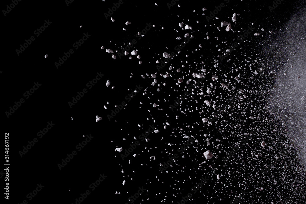 White powder explosion isolated on black background. White powder explosion isolated on black background.