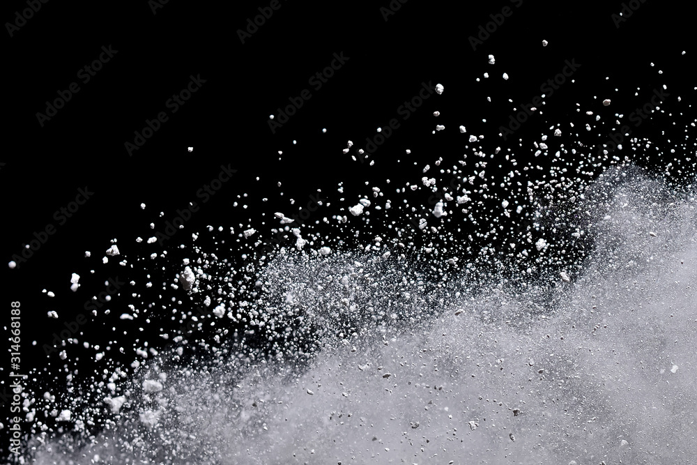 White powder explosion isolated on black background. White powder explosion isolated on black background.