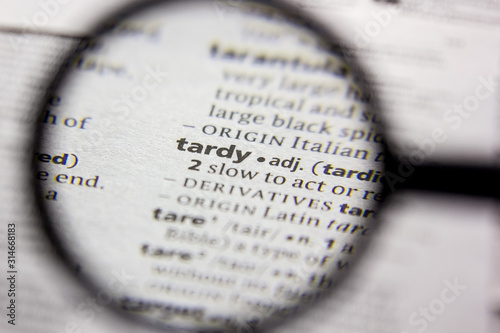 Word or phrase Tardy in a dictionary.