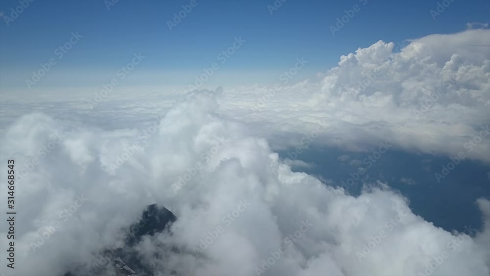 From great height divine white cumulus clouds heaven cloudscape thick fog above mountains. Beautiful abstract epic sky. Serene freedom ascends calm relaxation. Time lapse Aerial flight. Atmosphere From great height divine white cumulus clouds heaven cloudscape thick fog above mountains. Beautiful abstract epic sky. Serene freedom ascends calm relaxation. Time lapse Aerial flight. Atmosphere